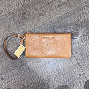 camel michael kors wristlet. never used!